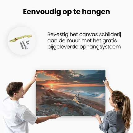 Canvas schilderij ophangen Drijfhout op een Strand bij Zonsondergang