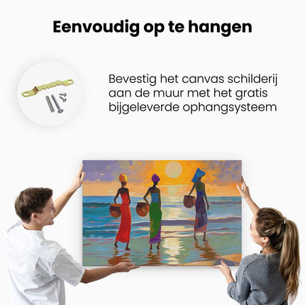 Canvas schilderij ophangen Drie Vrouwen Lopen op het Strand bij Zonsondergang