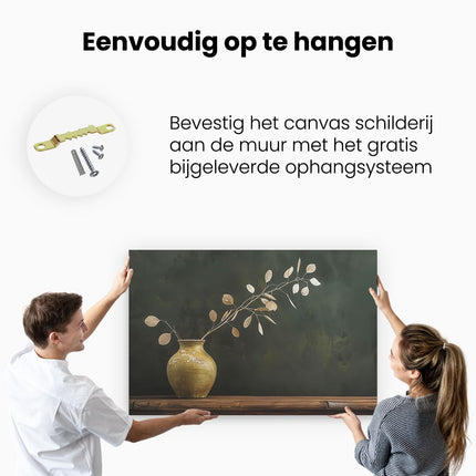 Canvas schilderij ophangen Vaas met Bladeren erin op een Tafel