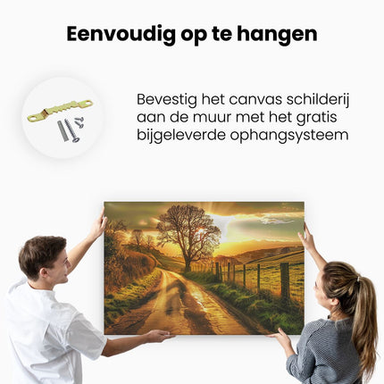 Canvas schilderij ophangen Eenzame Boom in een Veld bij Zonsondergang