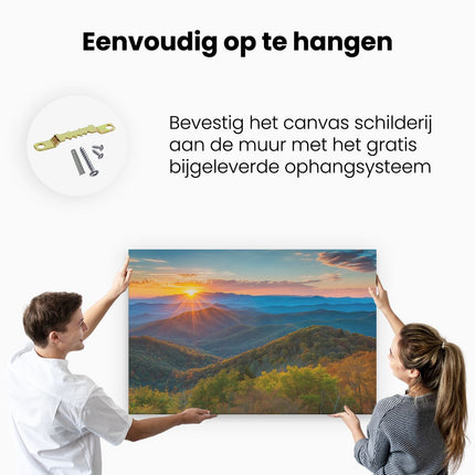 Canvas schilderij ophangen De Zon gaat onder over de Bergen in de Grote Rokerige Bergen