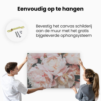 Canvas schilderij ophangen Roze Pioenrozen in een Vaas