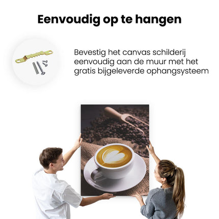 Canvas Schilderij Ophangen Kopje Koffie In Een Hartje Met Koffiebonen