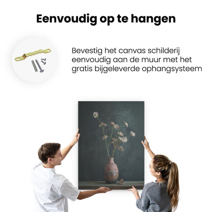 Canvas Schilderij Ophangen Bloemen in een Vaas op een Tafel