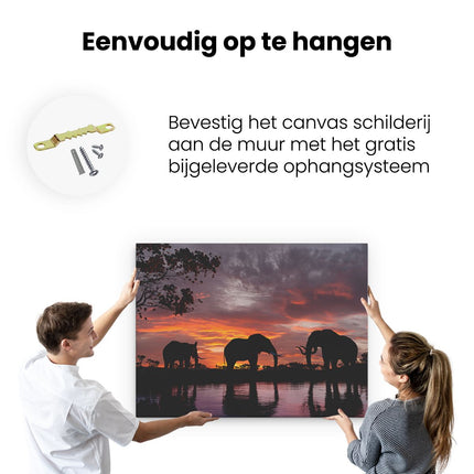 Canvas Schilderij Ophangen Olifanten Tijdens Zonsondergang - Silhouet