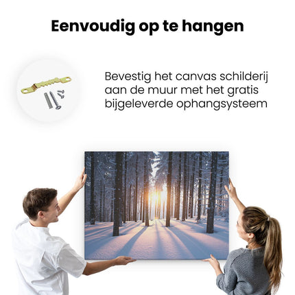 Canvas Schilderij Ophangen Bos Met Sneeuw Tijdens De Zonsondergang