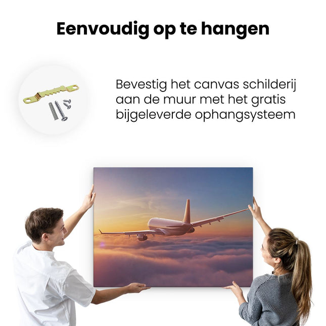 Canvas Schilderij Ophangen Vliegtuig In De Wolken Bij Zonsondergang