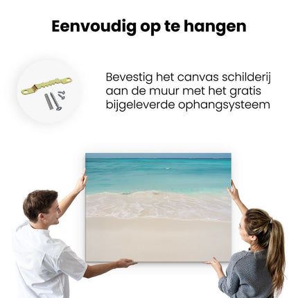 Canvas Schilderij Ophangen Wit Zandstrand met Blauw Water