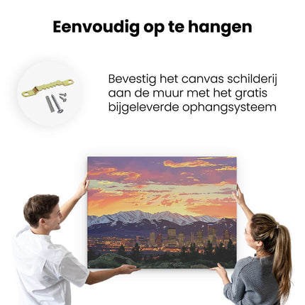 Canvas Schilderij Ophangen Stadsgezicht met Bergen op de Achtergrond