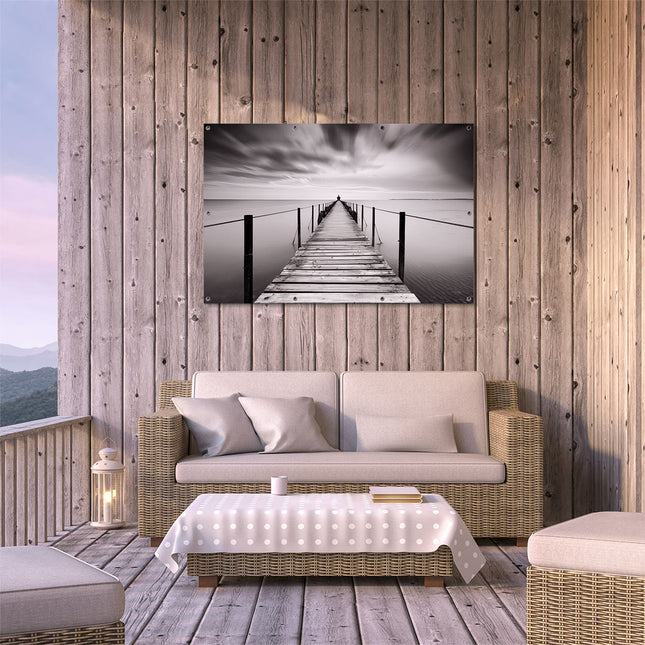 Tuinposter buiten terras Persoon die op een Pier Staat onder een Bewolkte Hemel